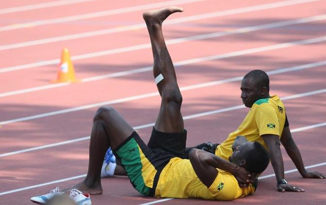 Usain Bolt si allena con i compagni al centro d'allenamento riservato alla delegazione caraibica. Un allenamento leggero, quattro chiacchiere e poi i massaggi